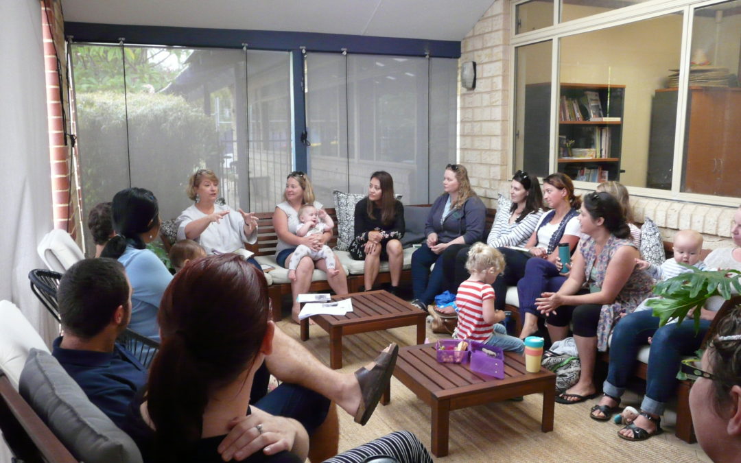 Rockingham Montessori School parents seated in a room, discussing children development