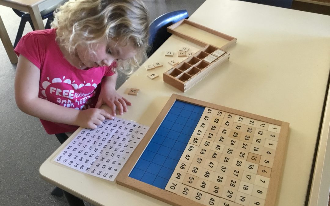 Rockingham Montessori female student playing with a numbers puzzle