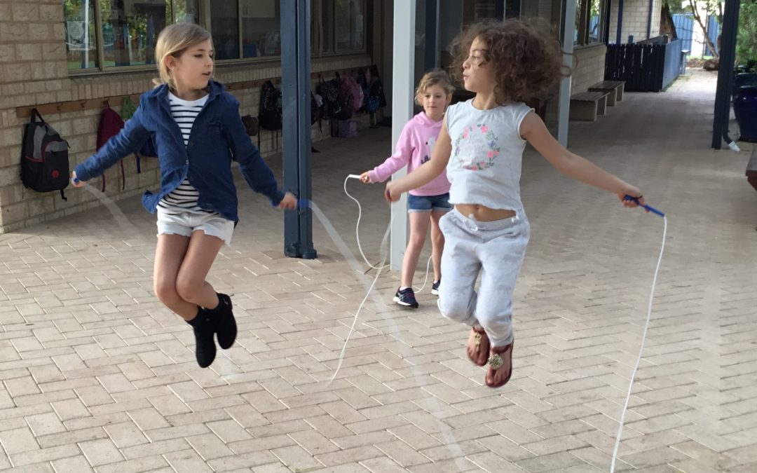 Rockingham Montessori female students kipping roap outside RMS classrooms