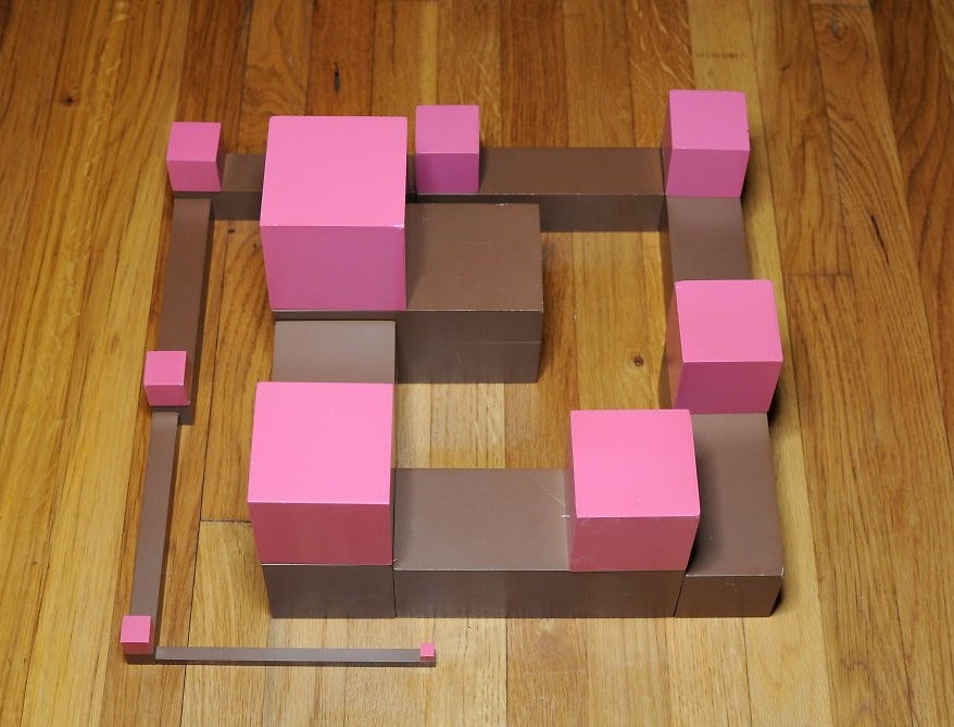 small brown and pink tower made of blocks