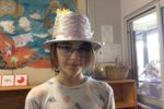 Rockingham Montessori student wearing a shiny silver hat for Upper Primary's art week