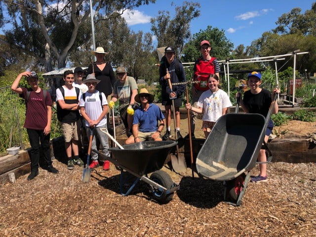 RMS students with gardening tools