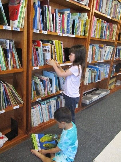 Children inside RMS library at Rockingham Montessori School
