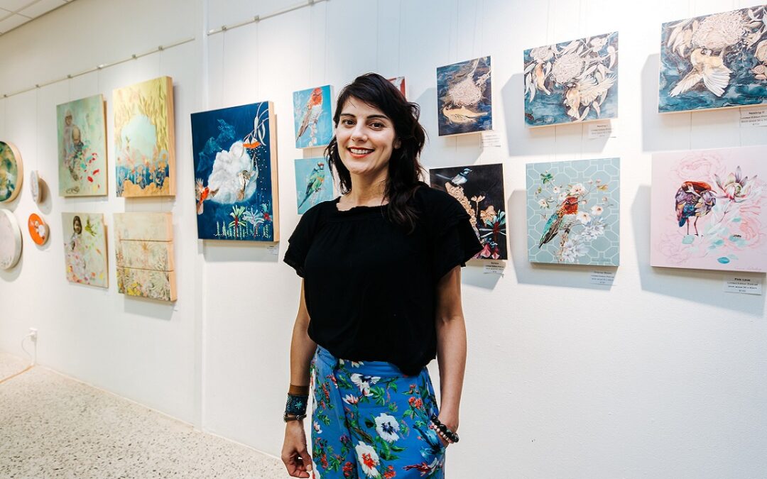 Vanessa Liebenberg posing with artworks