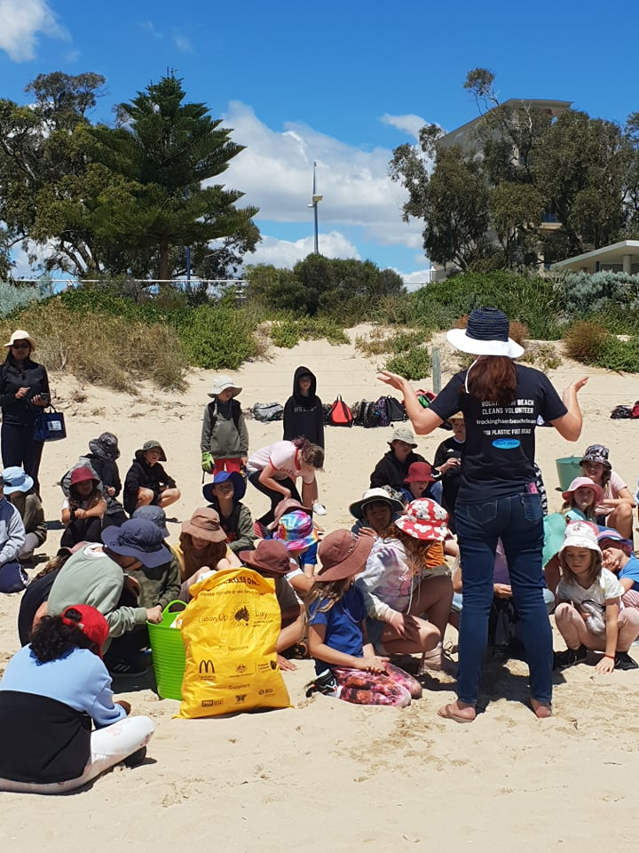 Students from Rockingham Montessori sitting on beach