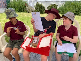 Three boys from Upper Primary at Rockingham Montessori visiting ANZAC Cottage