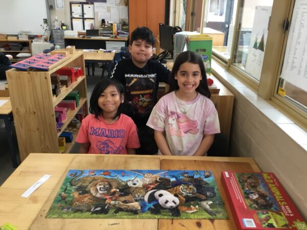 Students with jigsaw puzzle